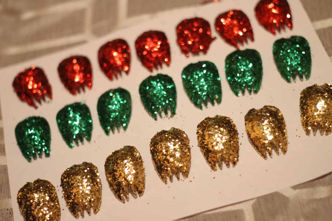 Based of sporks covered in glitter and lined up in rows for DIY Christmas Decorations