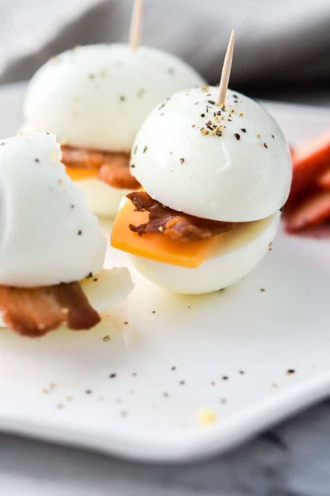 bacon, cheese and boiled eggs on a plate - cheap keto recipes