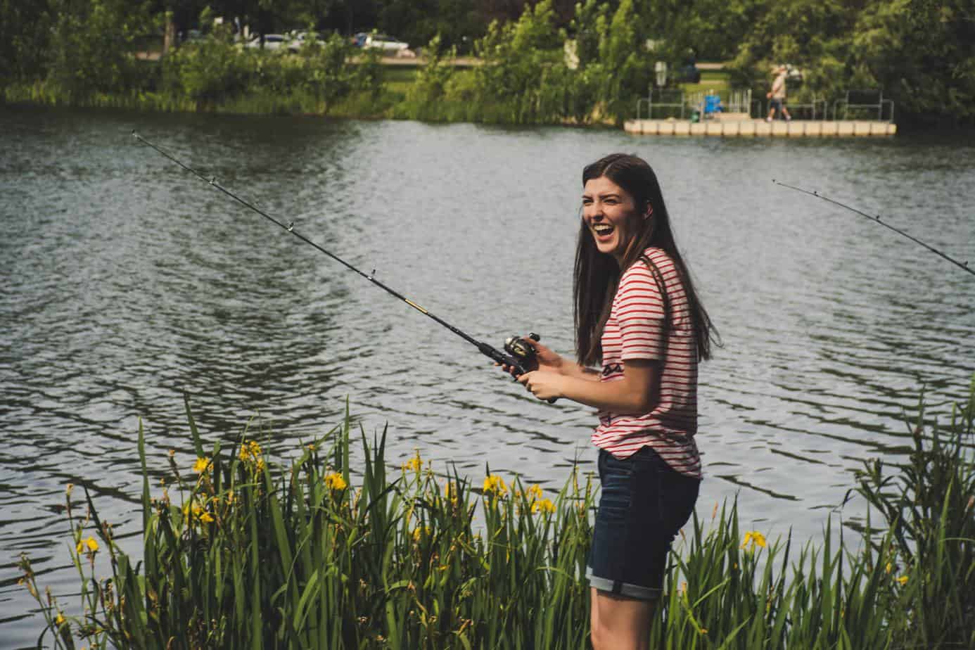 woman fishing by a lake - no spend weekend