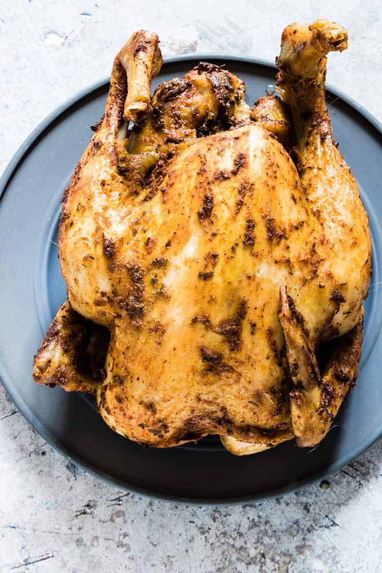 baked whole chicken on a plate - cheap keto meals