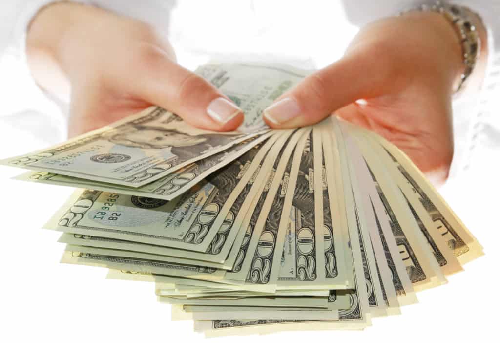 $50 bills in hand - make money fast today