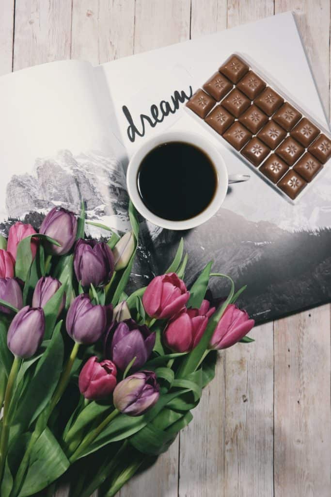 freebies today - flowers, coffee, book and chocolate on table - free subscriptions