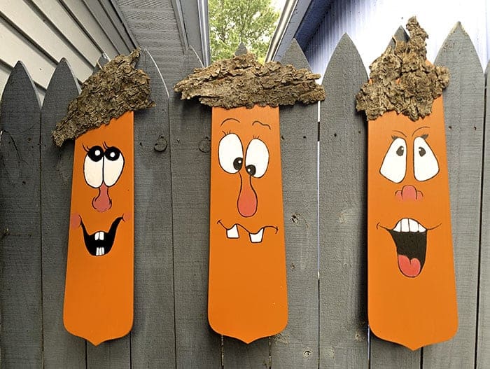 fall decor diy - three planks painted orange with faces