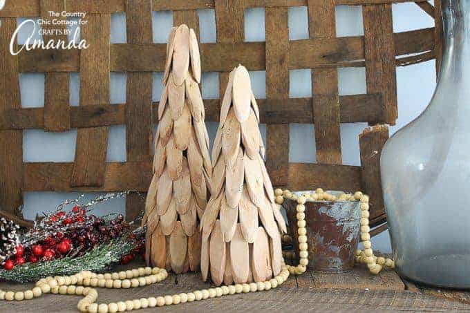 DIY Christmas Decor Projects - two little wood slice christmas trees