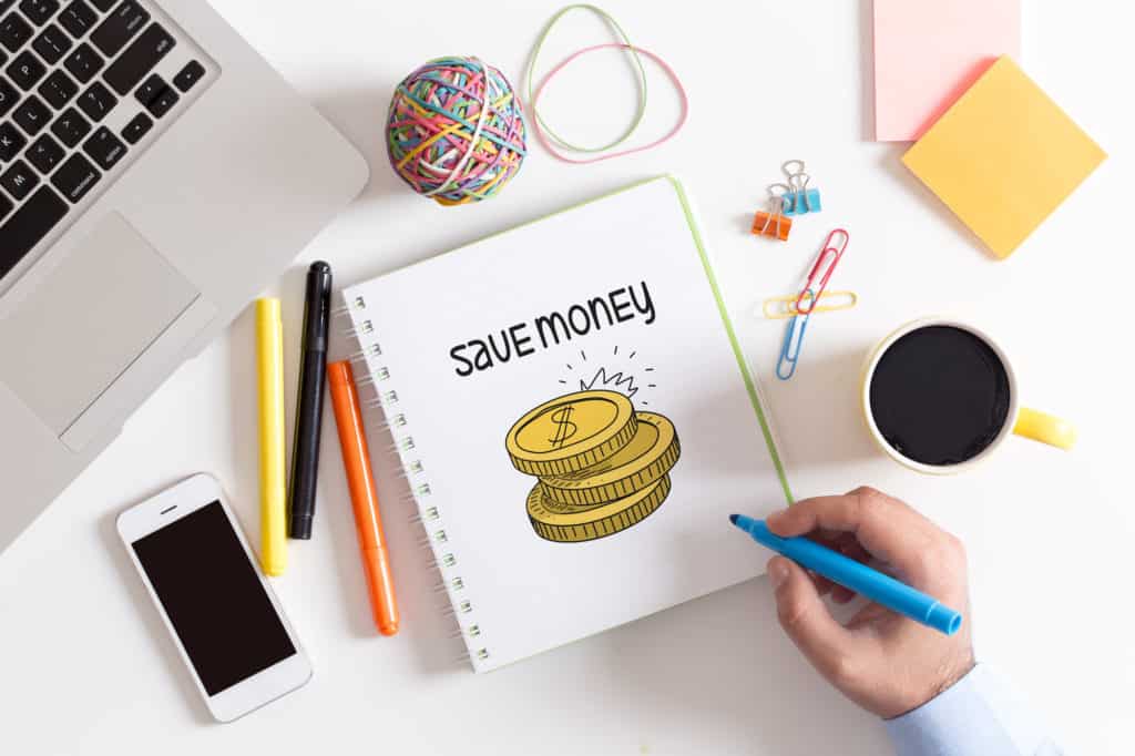 desk overlay with budget book - habits of people who always have money