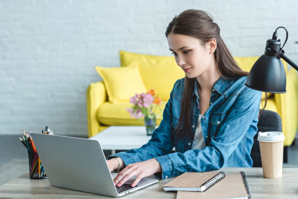 how to always have money - lady getting financial education on a laptop