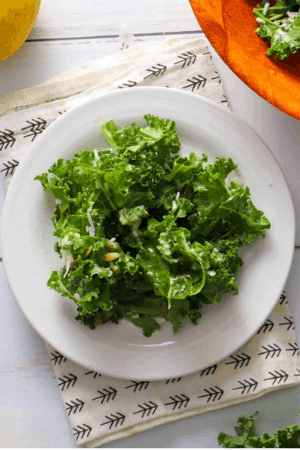 kale salad in bowl cheap thanksgiving sides