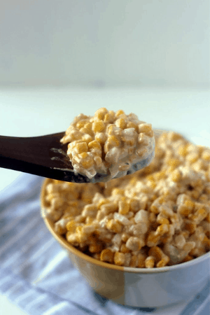 cream cheese corn in bowl and on spoon