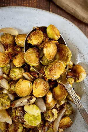 roasted brussels sprouts on spoon and in dish