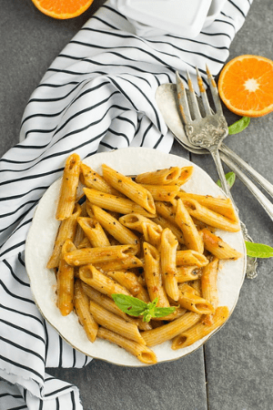 penne pasta in plate - cheap thanksgiving sides