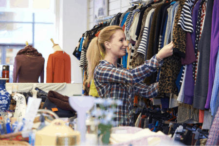 woman shopping in consignment shop near me