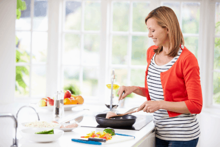 woman cooking in kitchen