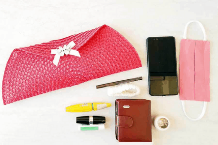 clutch and toiletries on a table