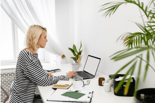 woman working at home desk - making candles to sell