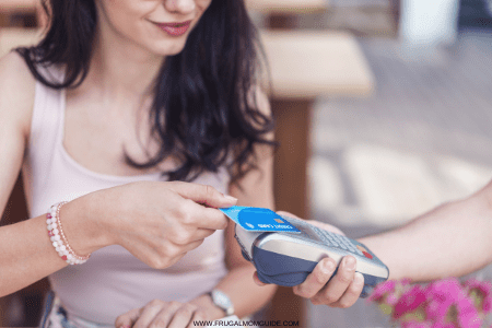 debit card not working - woman with card and point of sale machine