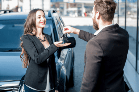 get 100 dollars now by renting your car - woman collecting car keys from man