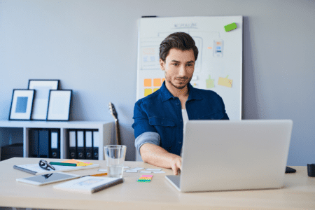 web designer working on laptop
