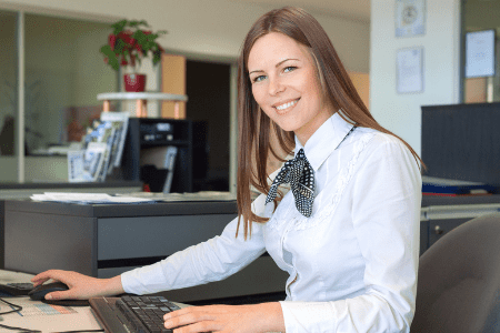 How to flip money in your bank account - female bank teller smiling