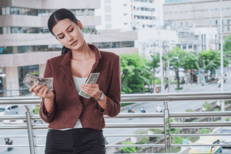 how can I flip my money - woman counting cash