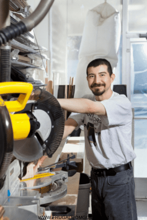 single person income - smiling man with power saw