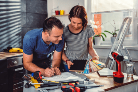 what to do after mortgage paid off - couple watching paint colors