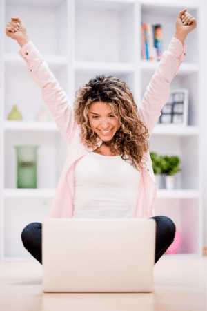 $2000 free money - happy woman with laptop