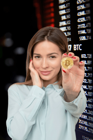 flipping bitcoin on cash app - woman holding up coin with bitcoin logo