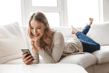 woman on couch on phone