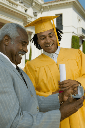 graduation gift etiquette - father giving son a ring for graduation