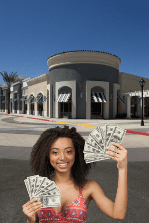 highest paying pawn shop near me - woman with cash at strip mall