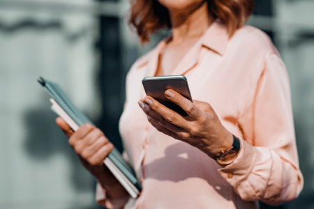 woman holding cell phone