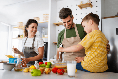 Family preparing a meal with the cheapest groceries