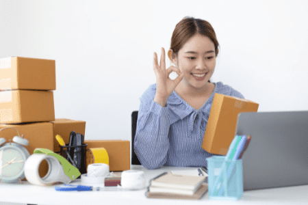 woman packing boxes for at home business