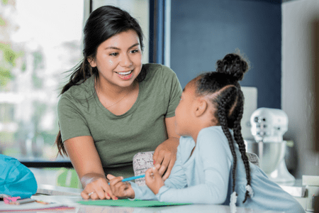 female tutor with little girl earning tutor hourly rate