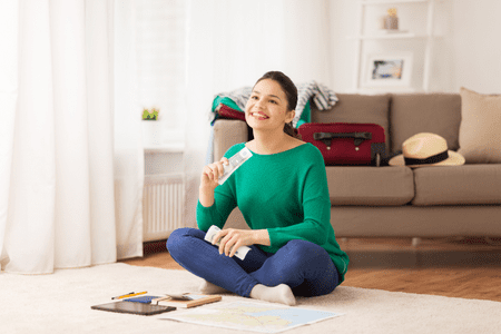 woman smiling and holding her free money instantly 