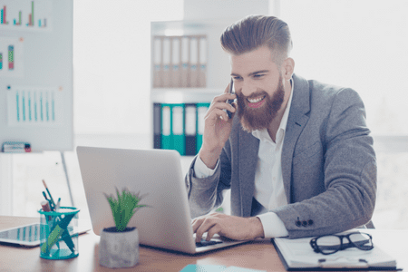 man with laptop researching 64000 a year is how much an hour