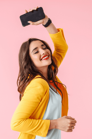 happy woman holding cell phone
