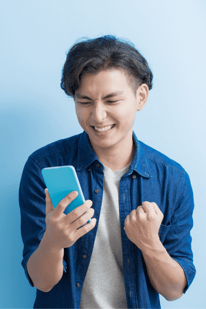 excited man on cell phone