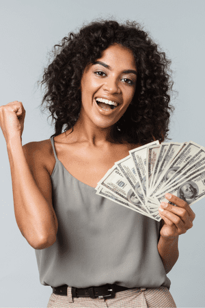 excited woman holding cash