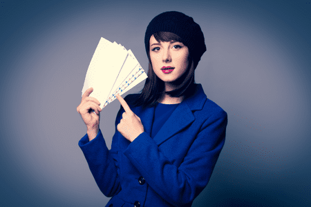 woman stuffing envelopes from home