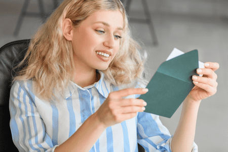 woman with envelope stuffing job