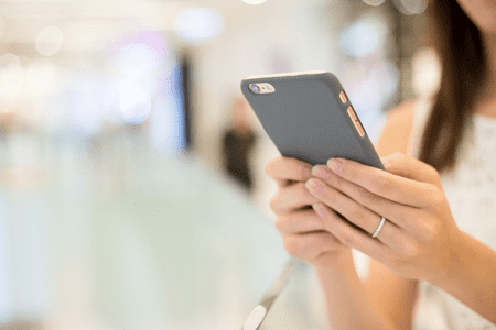 cell phone in woman's hands