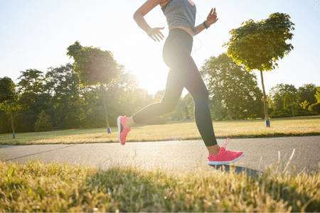 woman running in sneakers