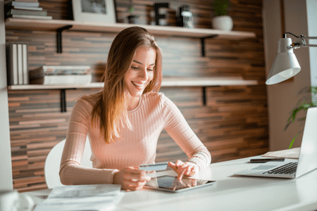 woman with tablet and 10 dollar sign up bonus