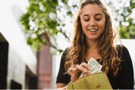 young lady smiling with $10 sign up bonus 