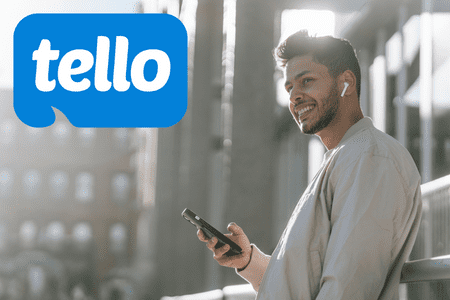 smiling man with phone and tello mobile ad