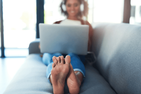 woman on couch with feet up - feetfinder review