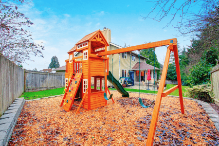 low maintenance hillside landscaping with playground