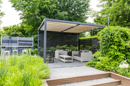 sloped backyard deck ideas with fabric roof