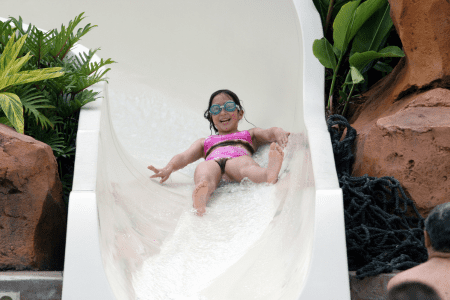 water slide with grotto on sloped landscape